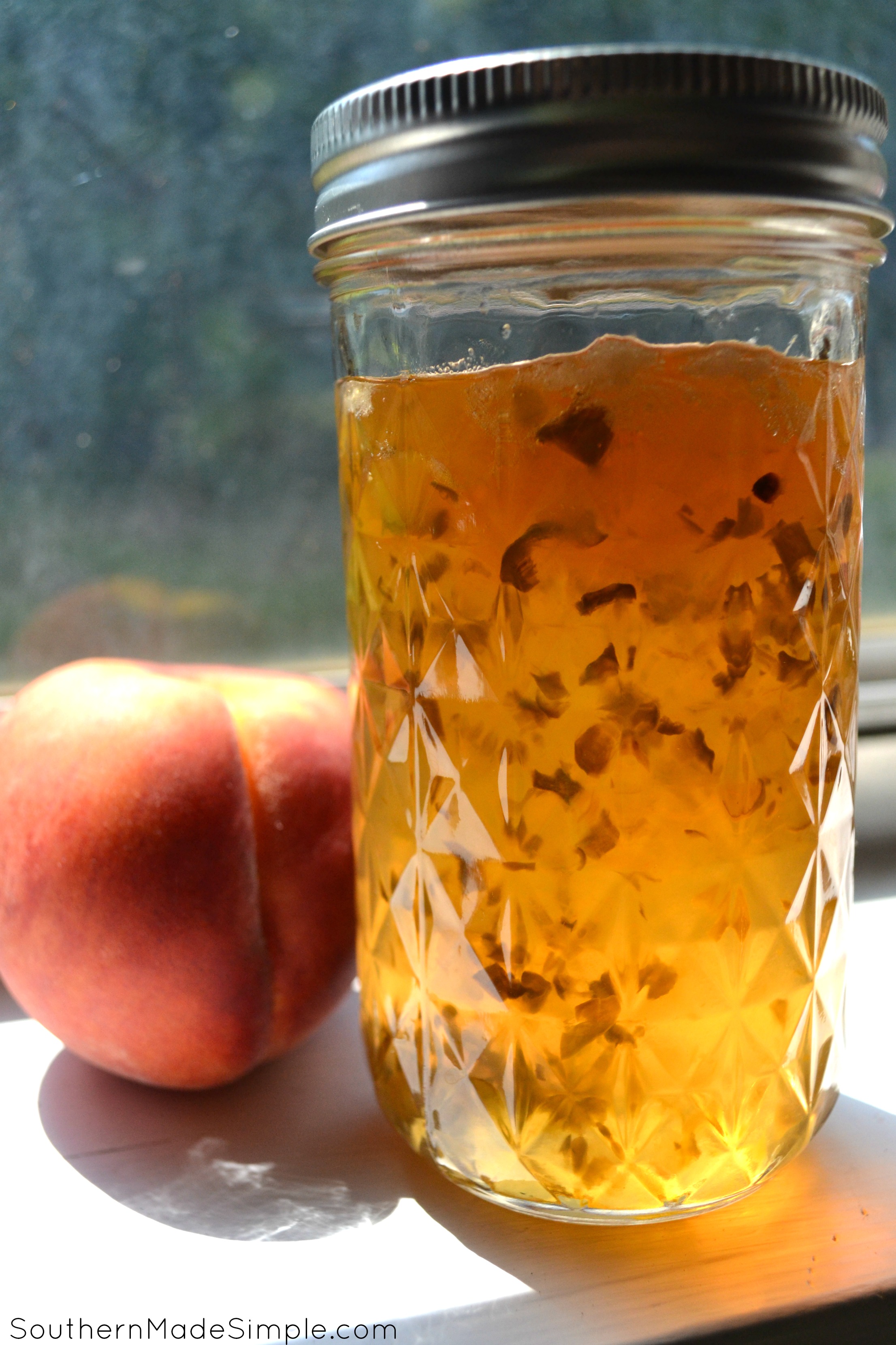 Jalapeno Peach Pepper Jelly - This recipe uses 3 different type of peppers, but you can easily substitute them to whatever you like. It has the perfect amount of heat and is AMAZING on just about anything!