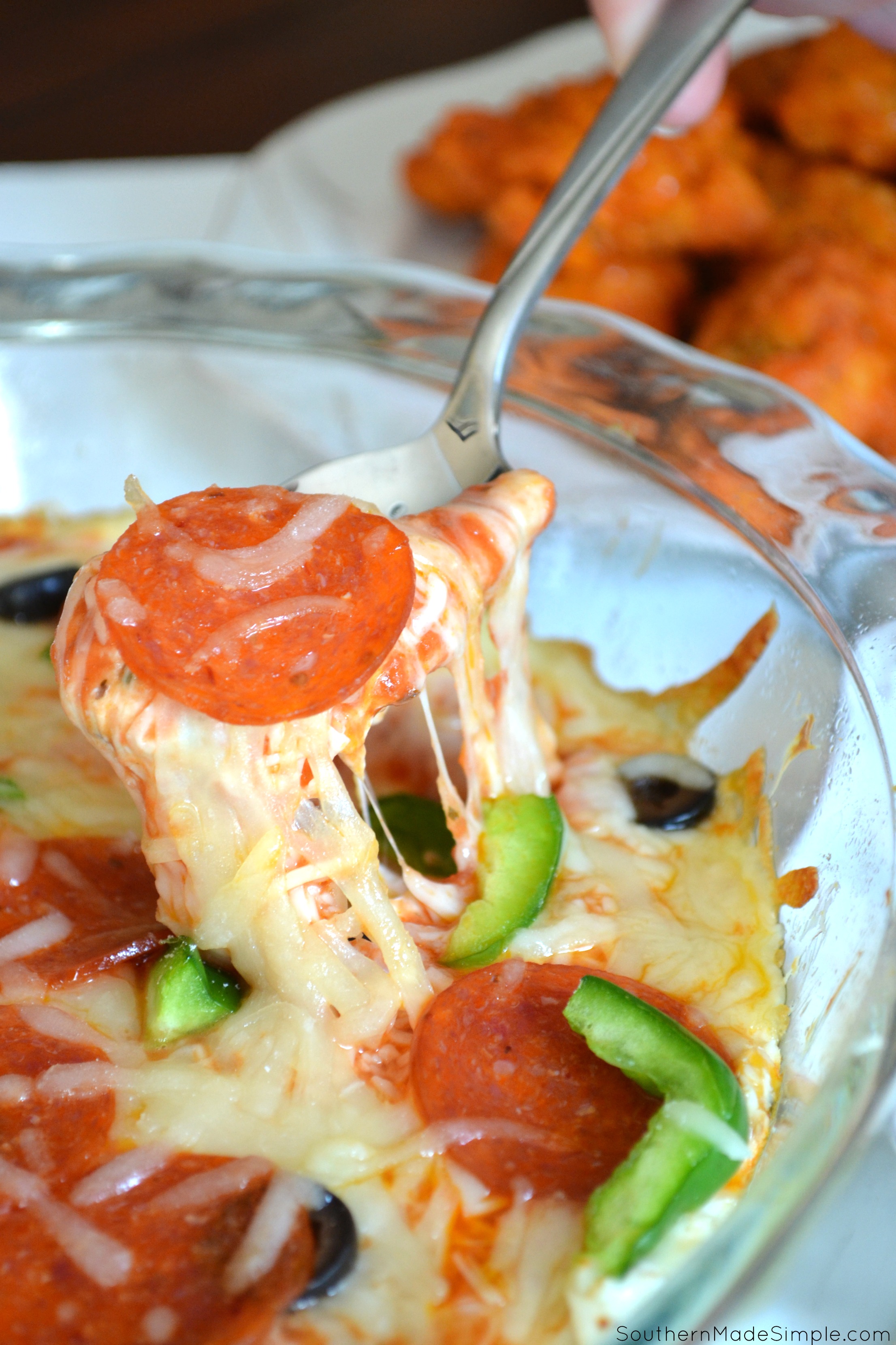 The 3 Cheese Pizza Dip is a PERFECT busy night meal solution that the whole family will love! Serve it with a side of mozzarella sticks and buffalo bites and keep the kiddos coming back for more! #20minutestotasty #ad