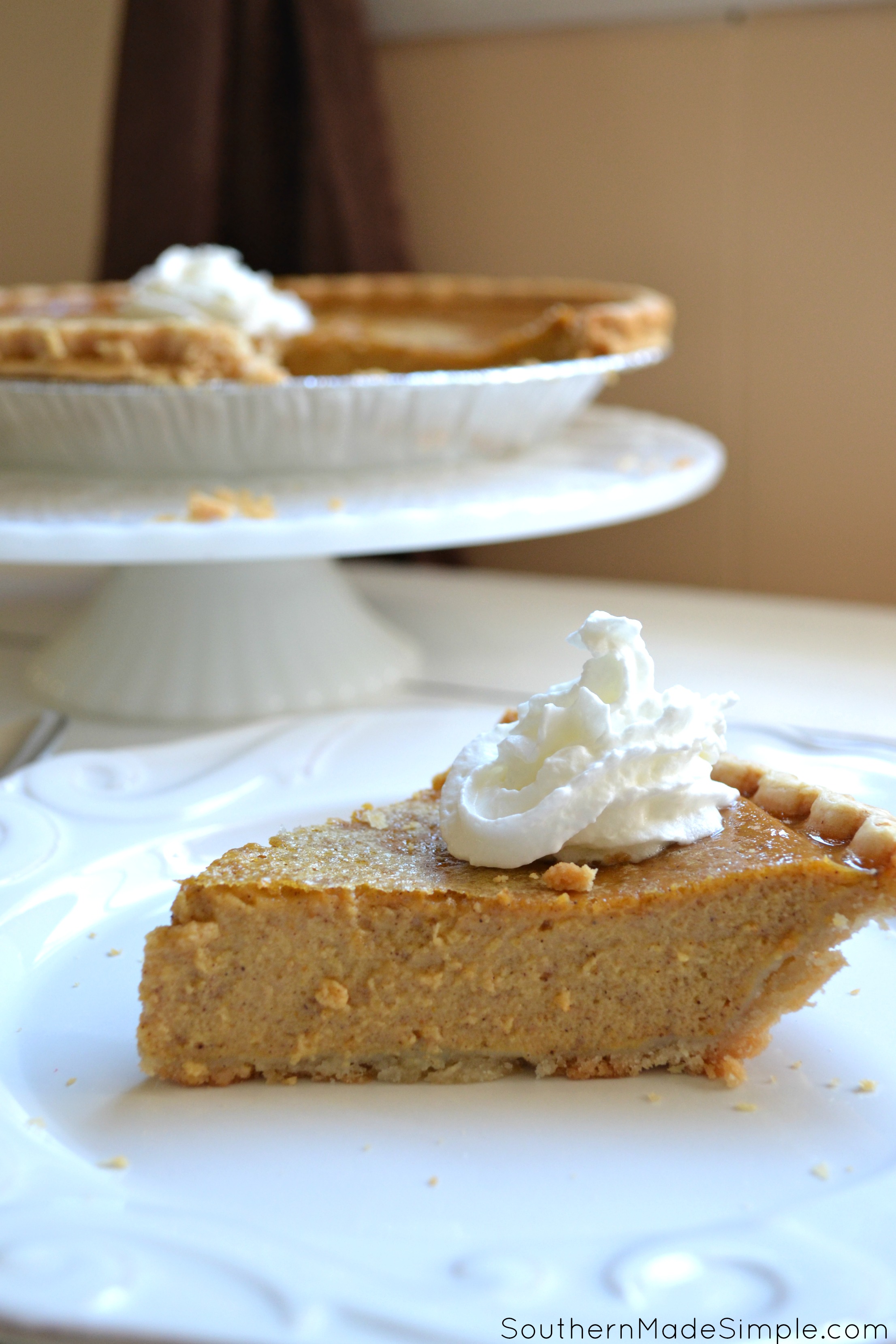 Pumpkin Custard Pie - a delicious twist on everyone's favorite Fall recipe: Pumpkin Pie! This particular pie has a very creamy texture and is perfect with a tall glass of milk!