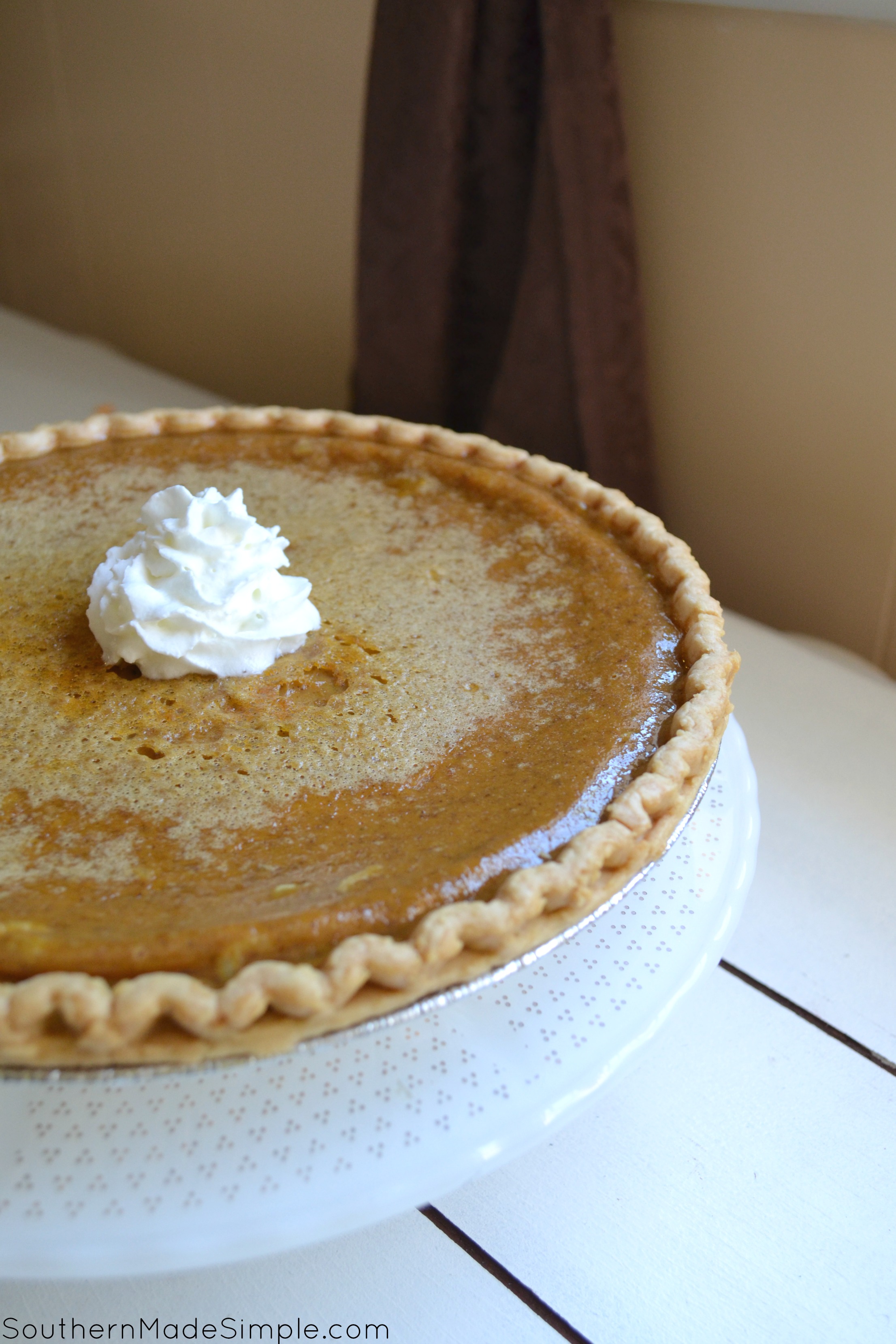 Pumpkin Custard Pie - a delicious twist on everyone's favorite Fall recipe: Pumpkin Pie! This particular pie has a very creamy texture and is perfect with a tall glass of milk!