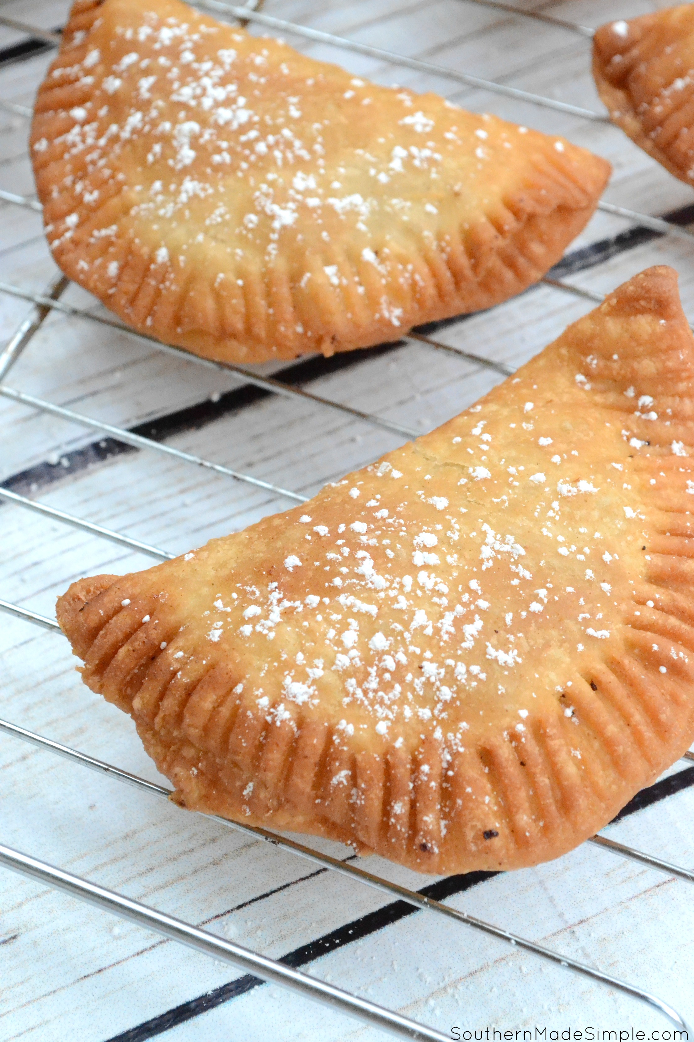 There's nothing better than taking a big of a flaky warm fried peach pie on those hot summer days, and this recipe for Southern Fried Peach Hand Pies is sure to be just the thing you need to make your summer extra sweet! #CreateWithOil #ad 