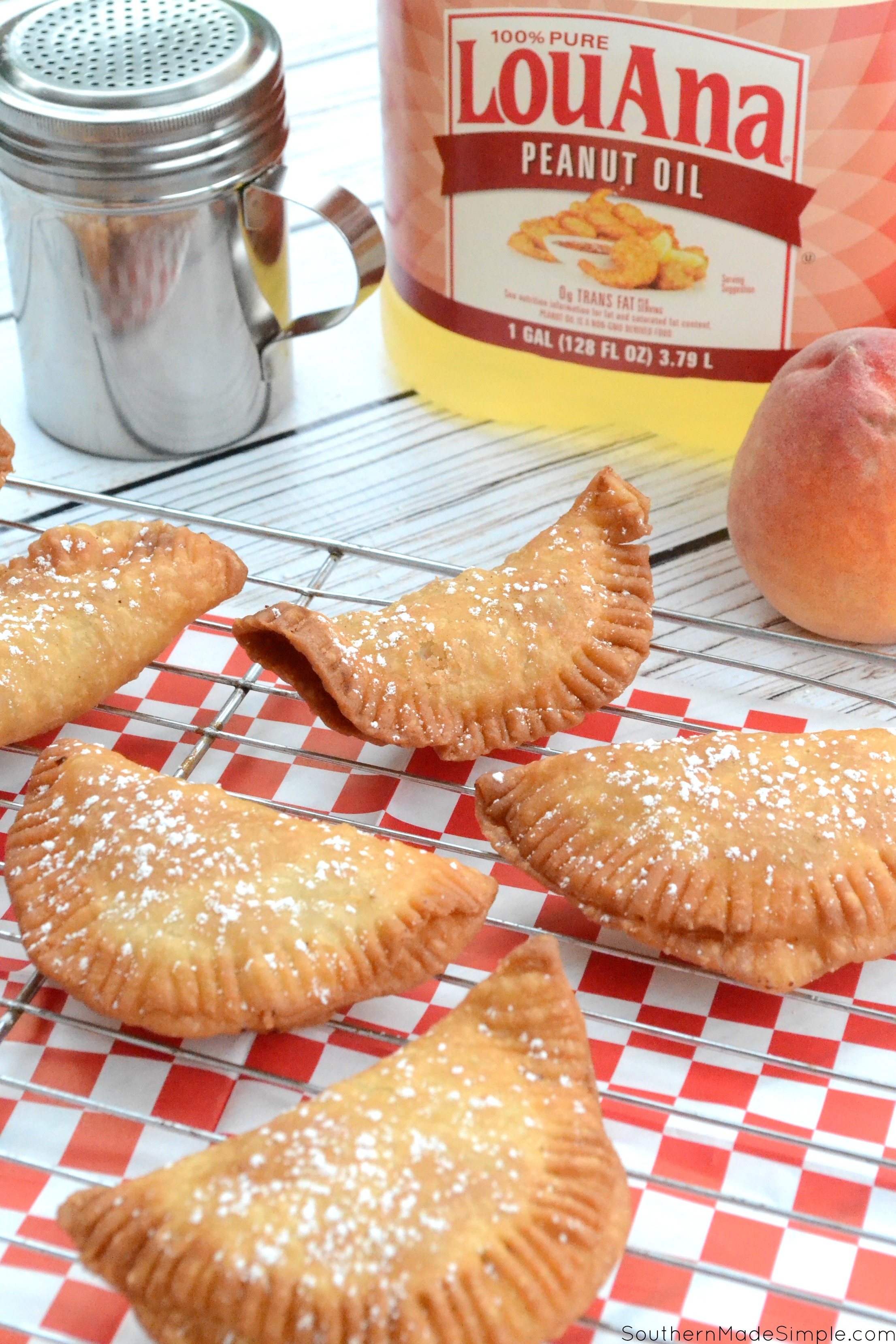 There's nothing better than taking a big of a flaky warm fried peach pie on those hot summer days, and this recipe for Southern Fried Peach Hand Pies is sure to be just the thing you need to make your summer extra sweet! #CreateWithOil #ad 