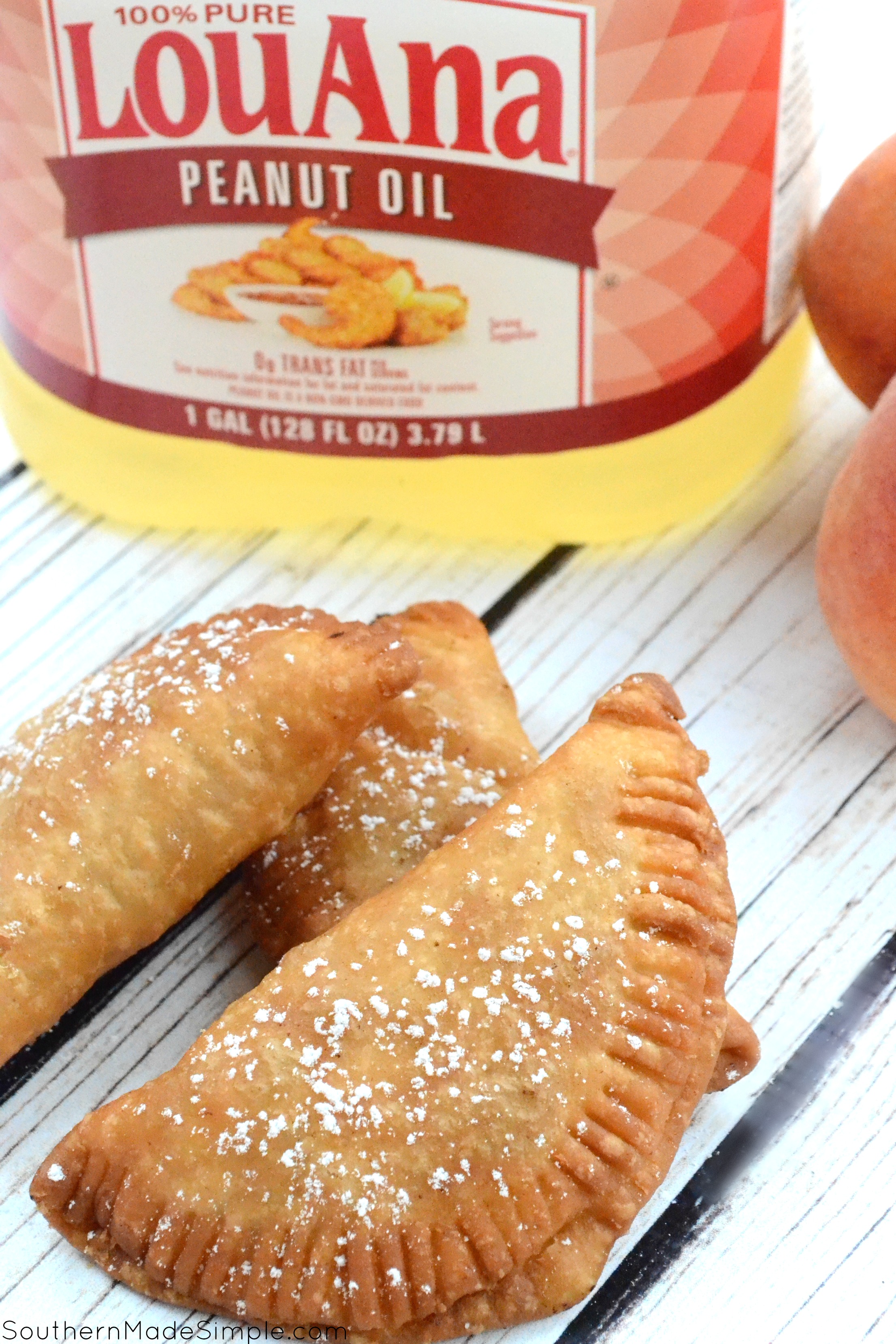 There's nothing better than taking a big of a flaky warm fried peach pie on those hot summer days, and this recipe for Southern Fried Peach Hand Pies is sure to be just the thing you need to make your summer extra sweet! #CreateWithOil #ad 