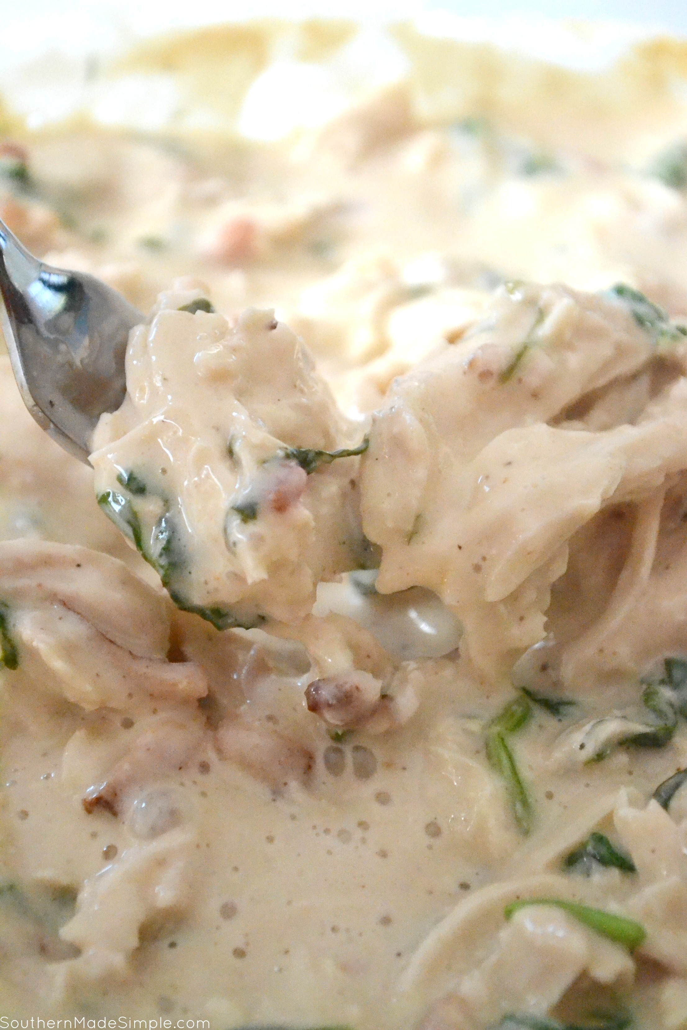 There's nothing better than a baked potato loaded with delicious cheesy goodness, and these Cheesy Chicken & Spinach Alfredo Baked Potatoes are overflowing with the the creamiest alfredo sauce made by Ragu that will make you go back for seconds!