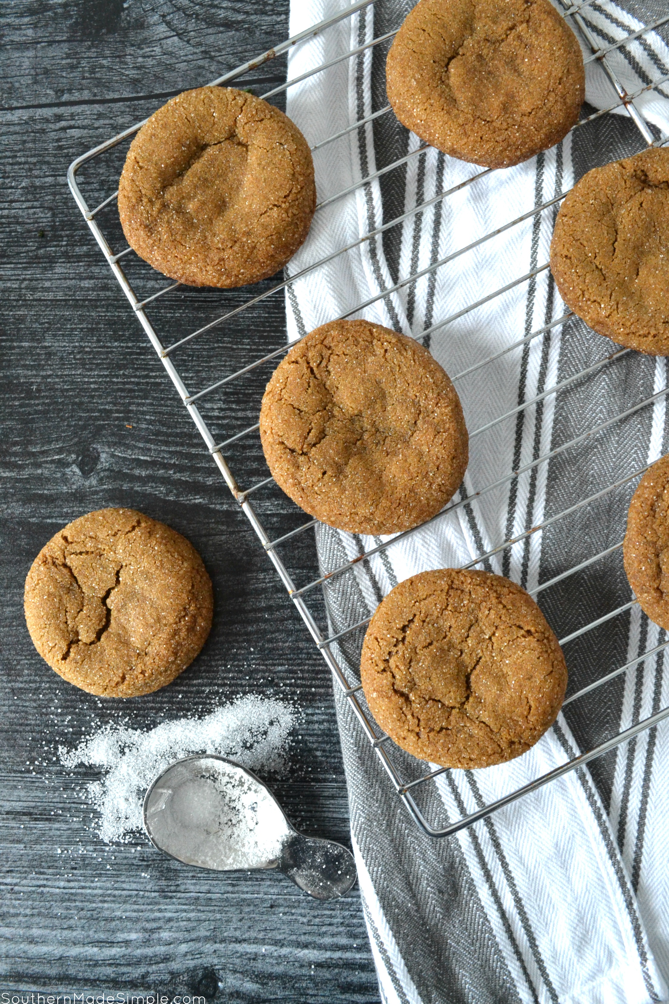 These Molasses Sugar Cookies are crisp on the outside, chewy on the inside and coated in sweet sugar crystals. They make the whole house smell like christmas when they're in the oven, and you definitely can't eat just one! #molassescookies