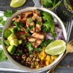 Cilantro Lime Chicken Taco Bowls are a perfect weeknight meal to celebrate your favorite night of the week: Taco Tuesday! Using Secolari Artisan Cilantro Olive Oil, the rich flavors of pressed cilantro in the grilled chicken really come to life! #ad