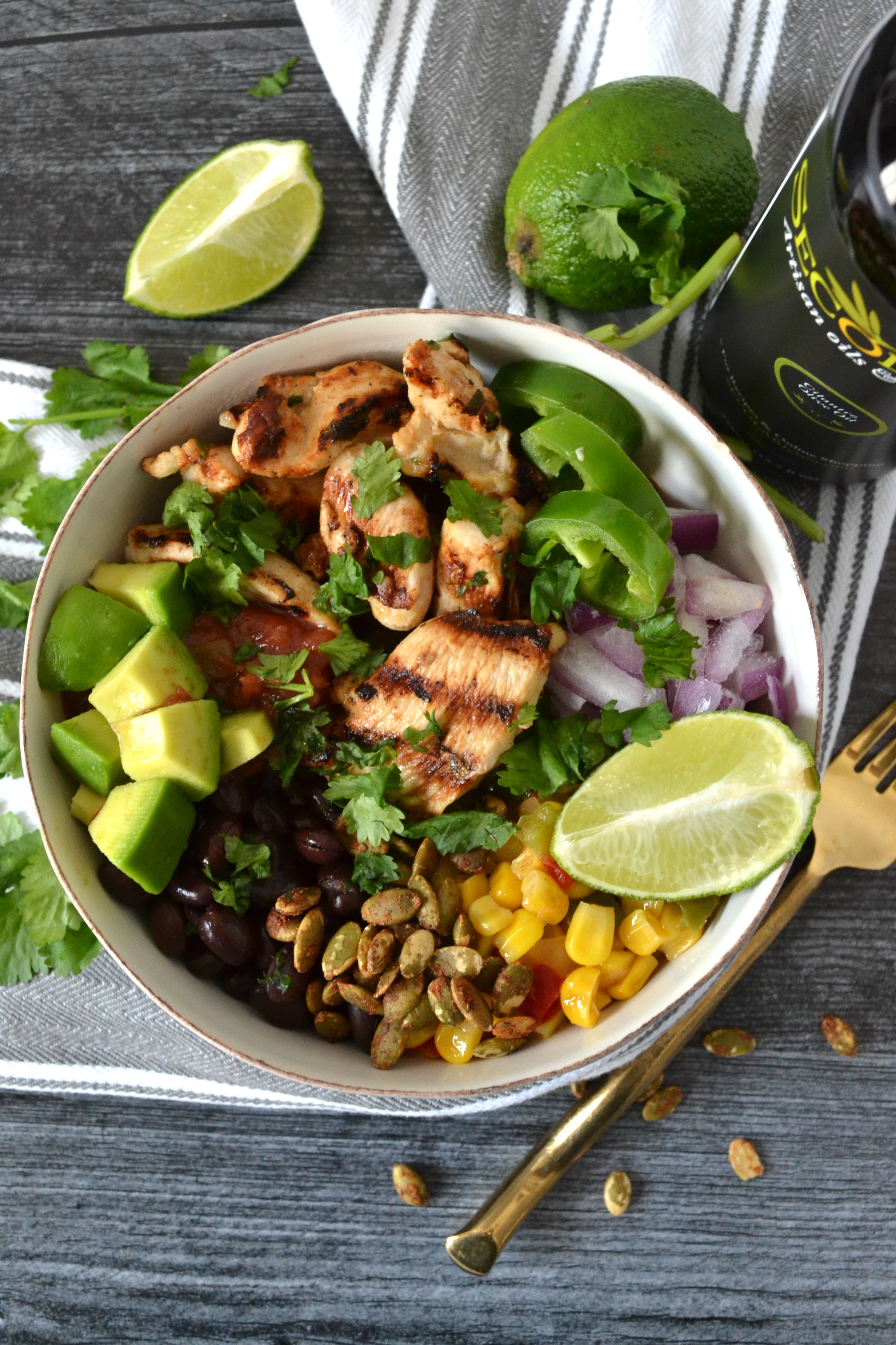 Cilantro Lime Chicken Taco Bowls are a perfect weeknight meal to celebrate your favorite night of the week: Taco Tuesday! Using Secolari Artisan Cilantro Olive Oil, the rich flavors of pressed cilantro in the grilled chicken really come to life! #ad 