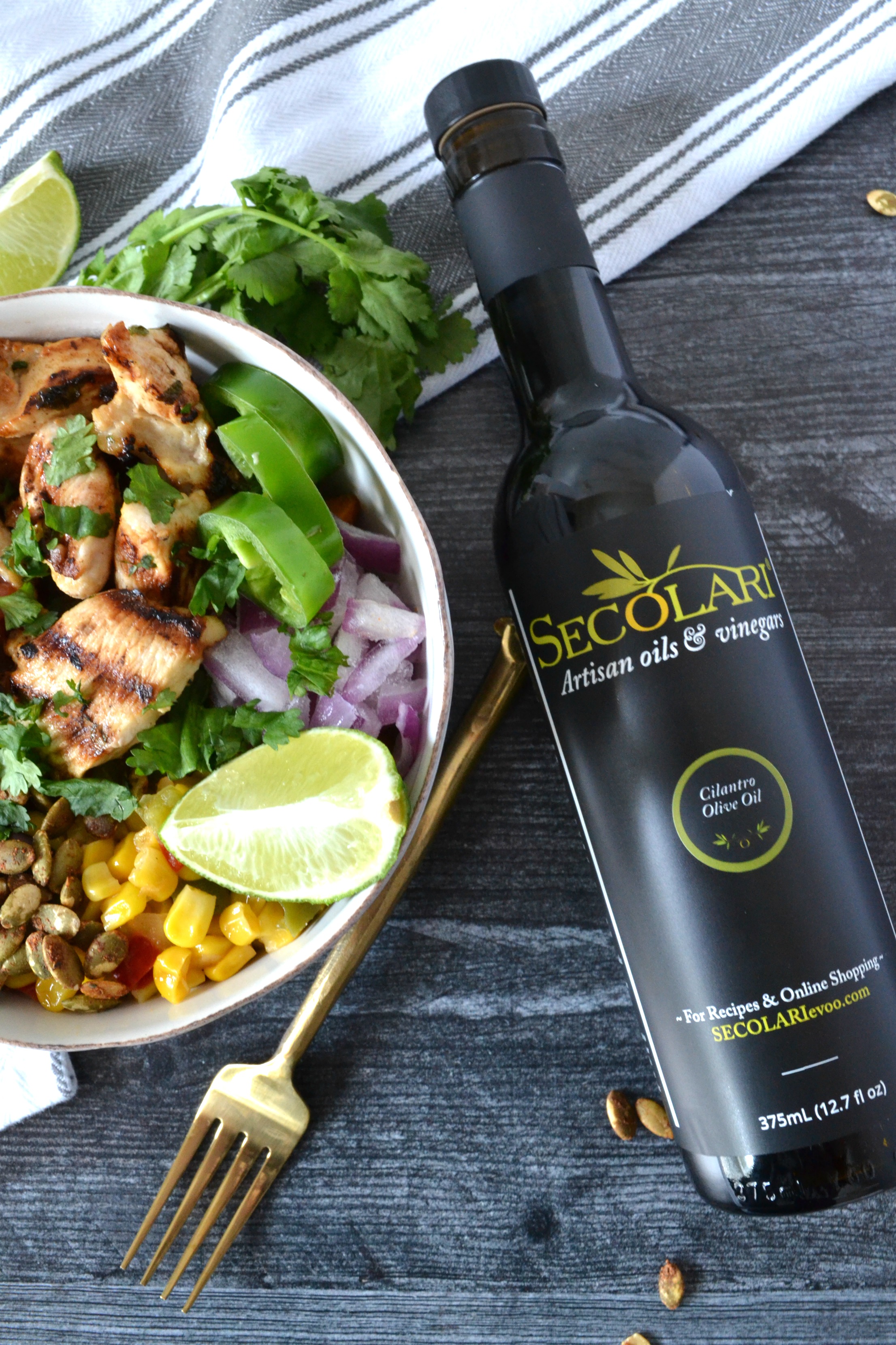 Cilantro Lime Chicken Taco Bowls are a perfect weeknight meal to celebrate your favorite night of the week: Taco Tuesday! Using Secolari Artisan Cilantro Olive Oil, the rich flavors of pressed cilantro in the grilled chicken really come to life! #ad 