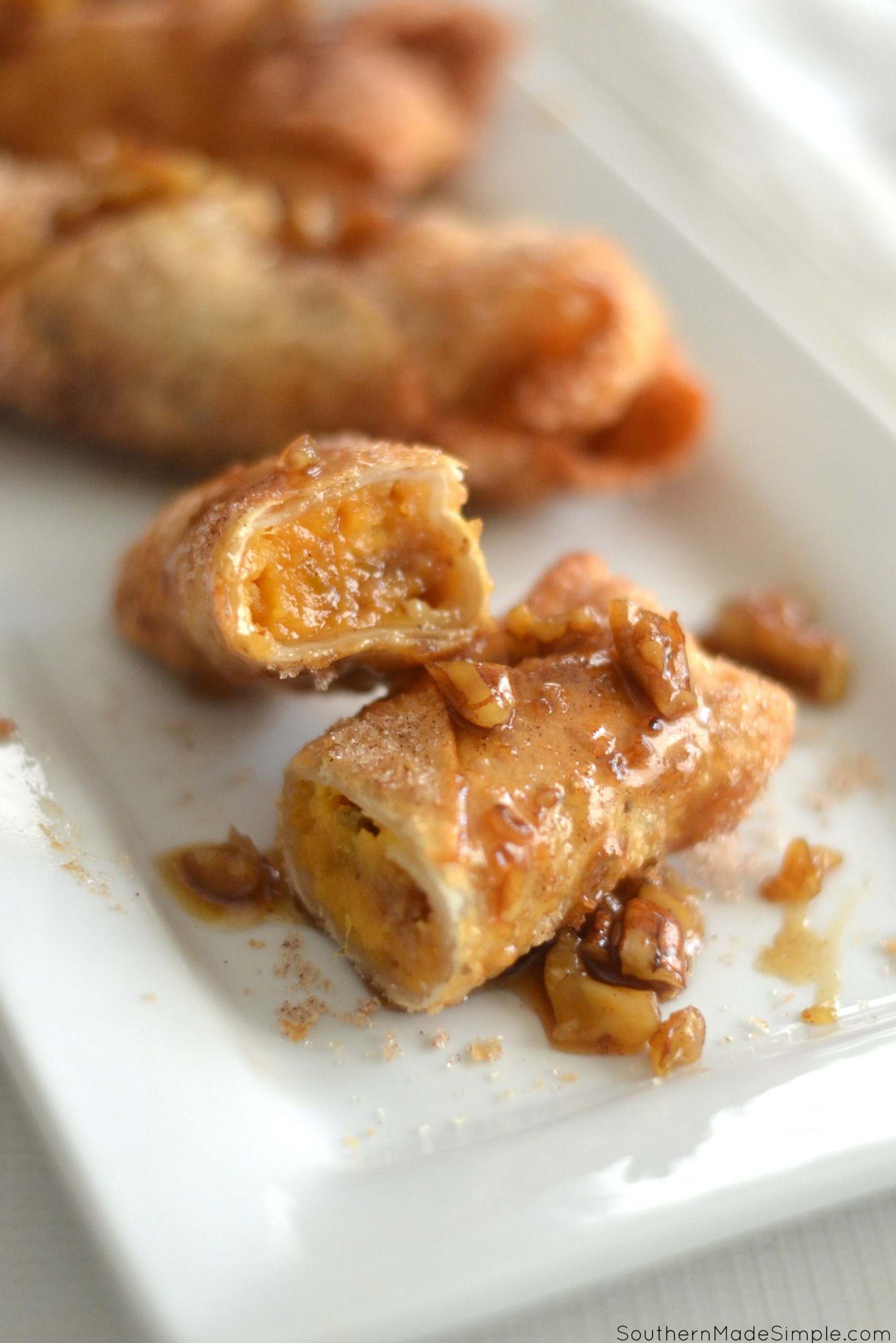 Sweet Potato Casserole Stuffed Egg Rolls with Caramel Bourbon Pecan Praline Sauce